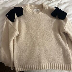 Excellent condition girls size 7 Cream Sweater with Black velvet Bow Accents